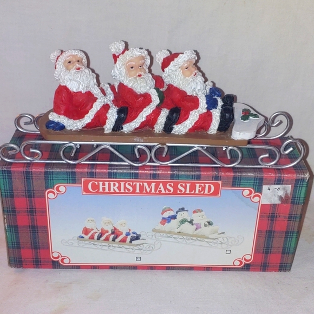 Santas on sled Christmas decoration